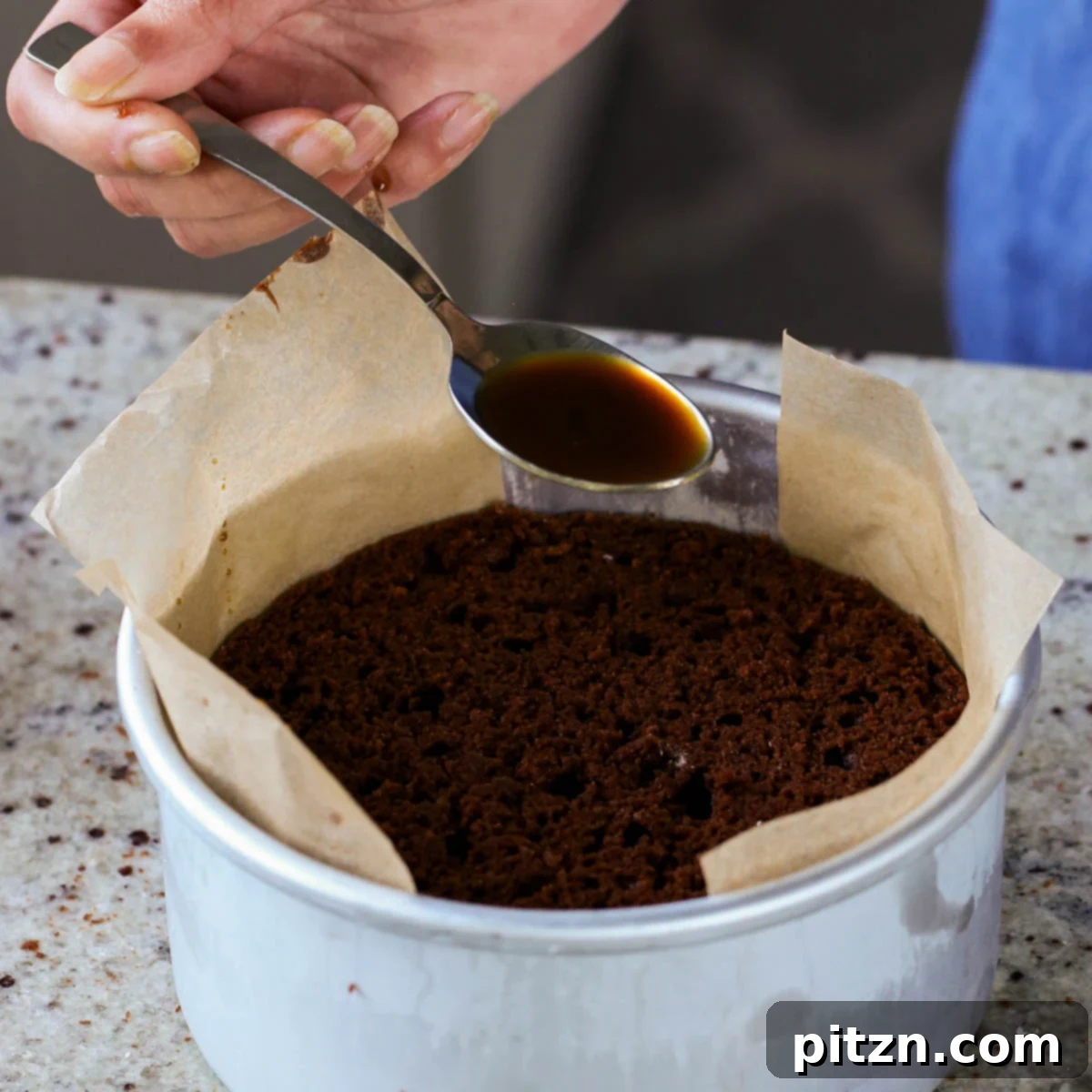 Decadent Vegan Mocha Cake with Velvety Chocolate Mousse (Gluten-Free Option) 20 spooning coffee syrup onto the second layer of mocha cake