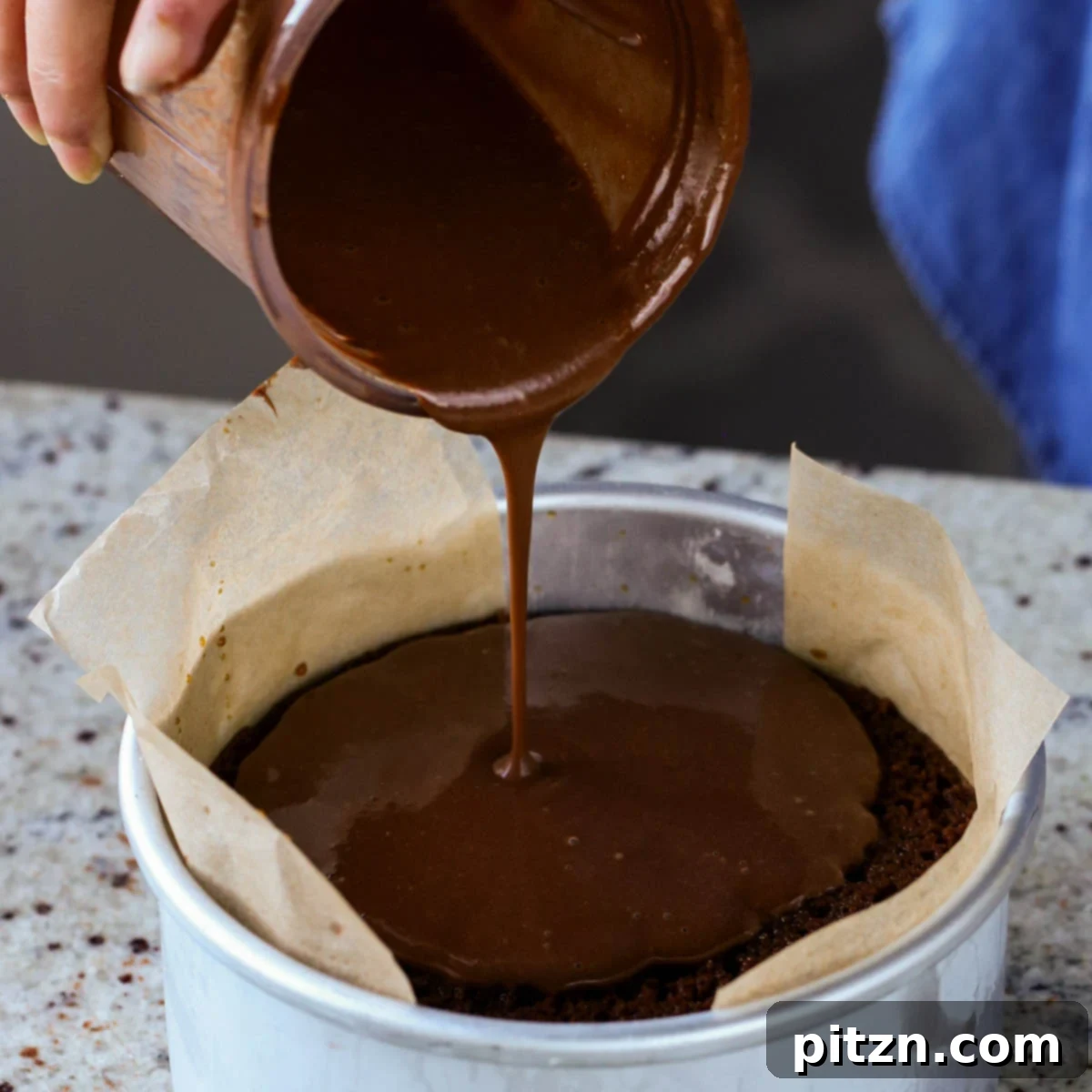 Decadent Vegan Mocha Cake with Velvety Chocolate Mousse (Gluten-Free Option) 21 pouring on the second layer of mocha pudding