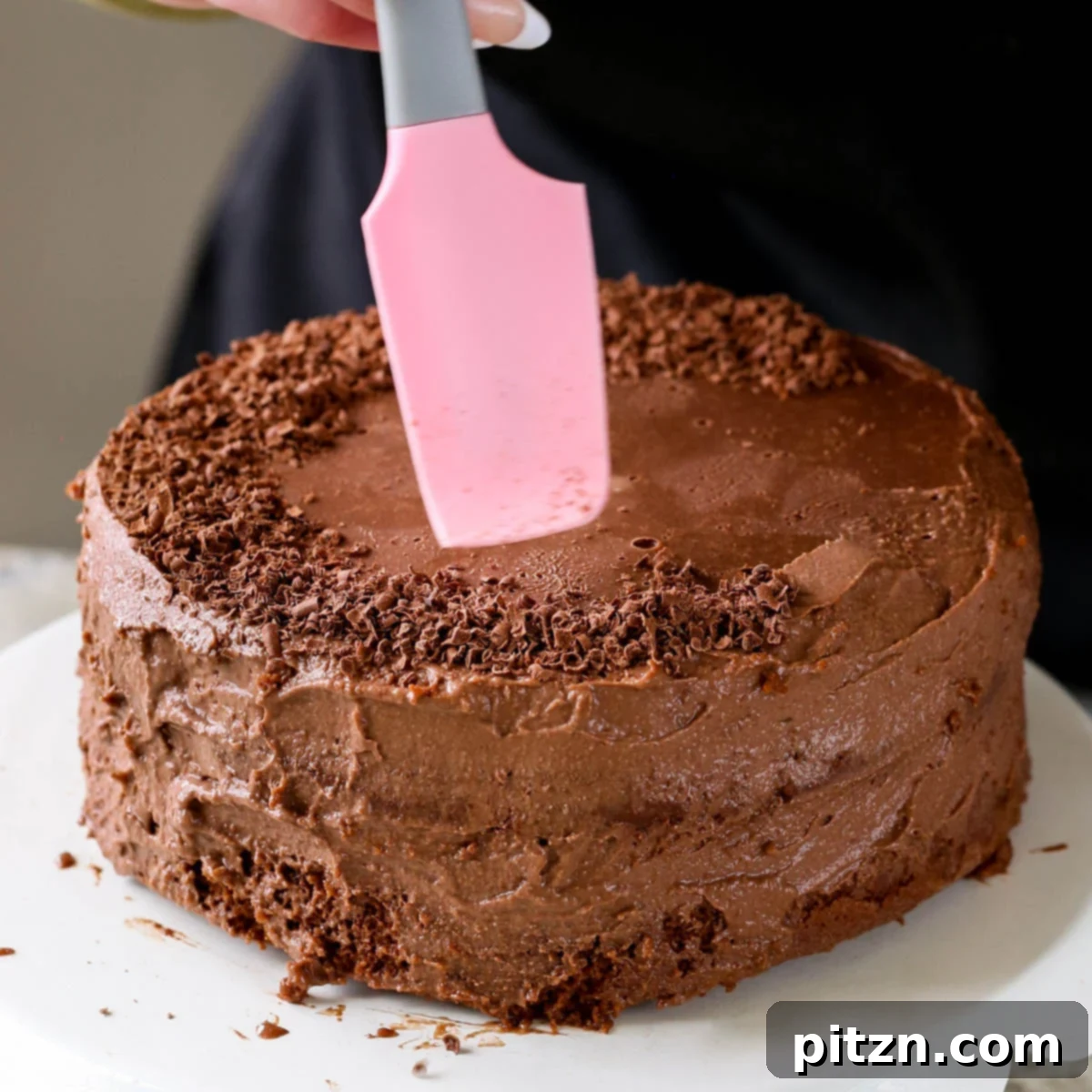Decadent Vegan Mocha Cake with Velvety Chocolate Mousse (Gluten-Free Option) 24 adding shaved chocolate to the mocha cake after frosting