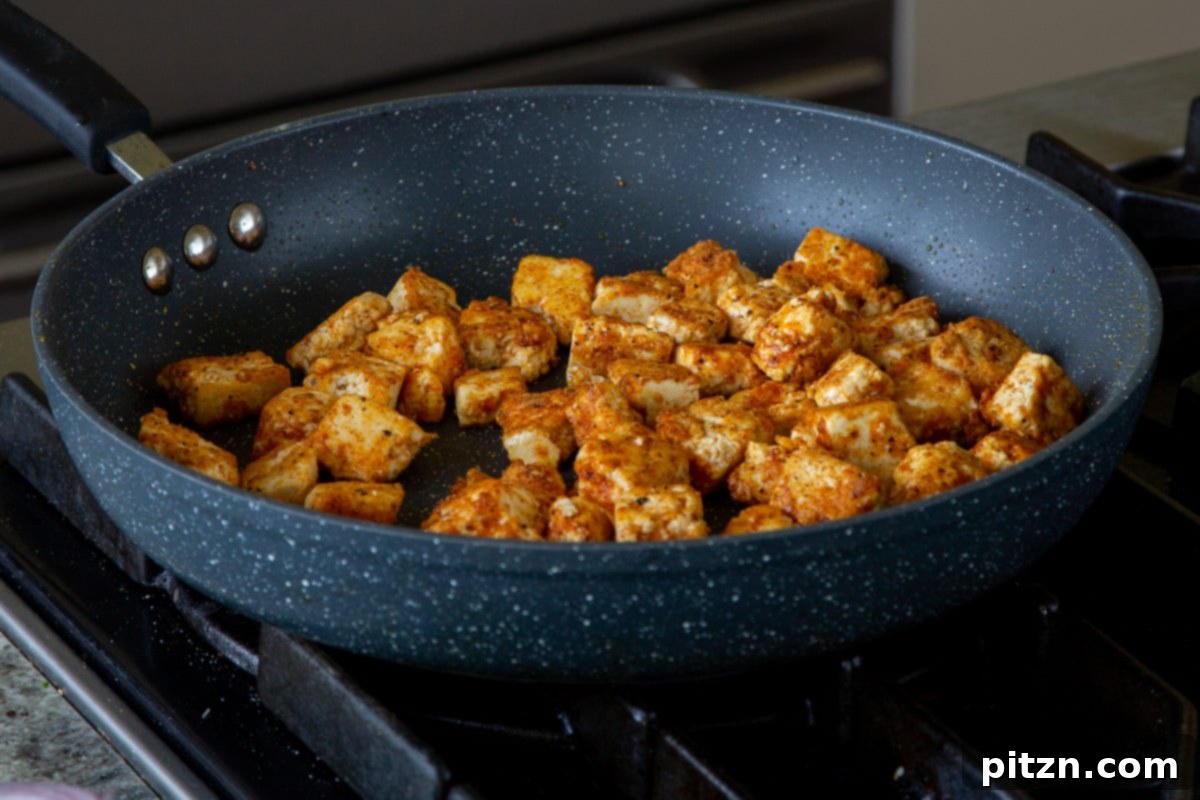 South Indian Black Pepper Tofu Fry 12 Crispy, golden-brown tofu pieces in a pan after cooking