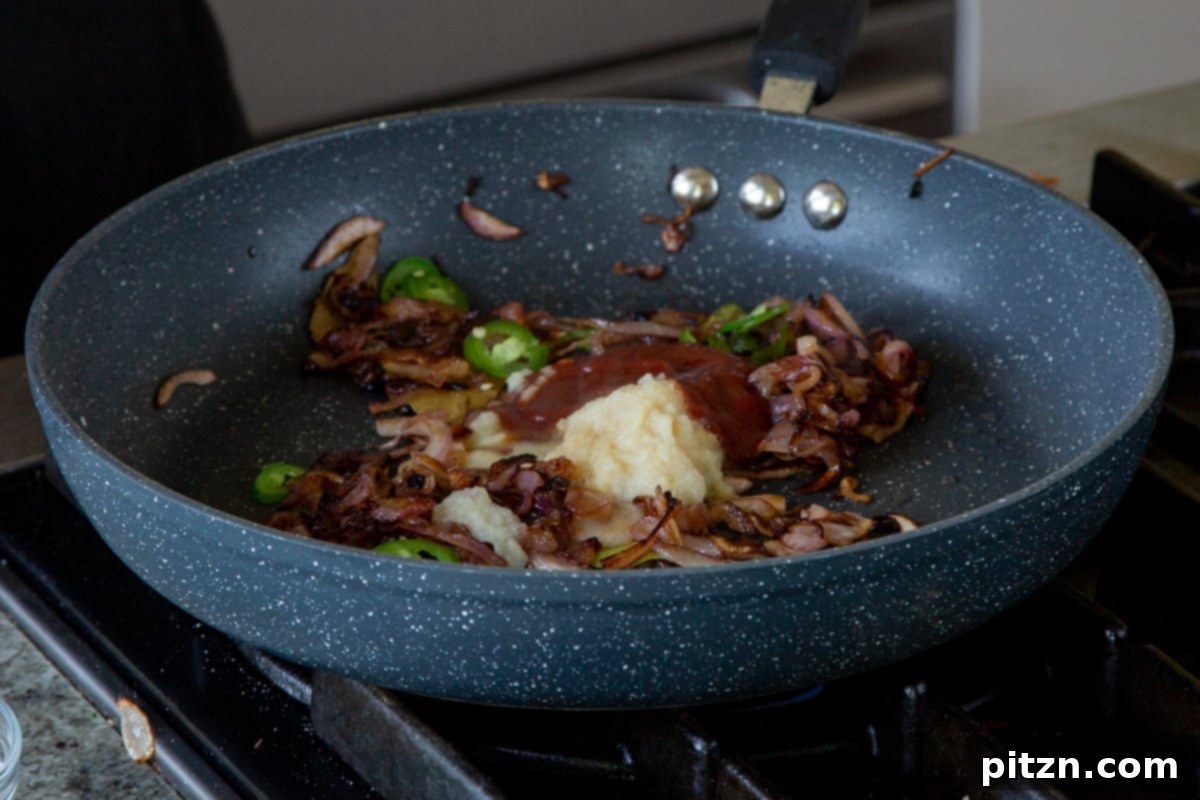South Indian Black Pepper Tofu Fry 15 Ketchup and ginger-garlic paste added to softened, cooked onions in the pan