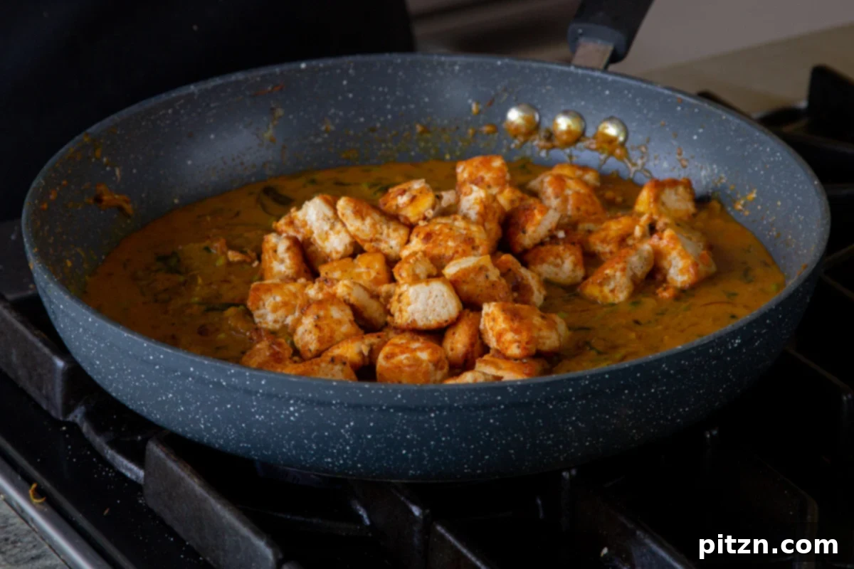 South Indian Black Pepper Tofu Fry 18 Crispy tofu being added back into the rich, simmering pepper fry sauce
