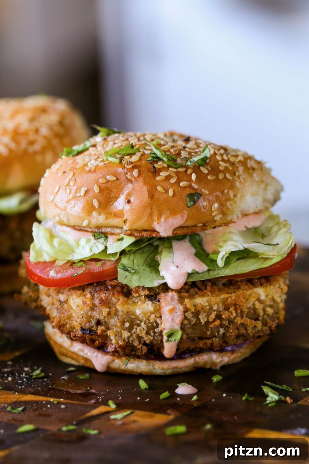 The Inclusive Crispy Vegan Chicken Sandwich 2 close-up of a spicy vegan chicken sandwich