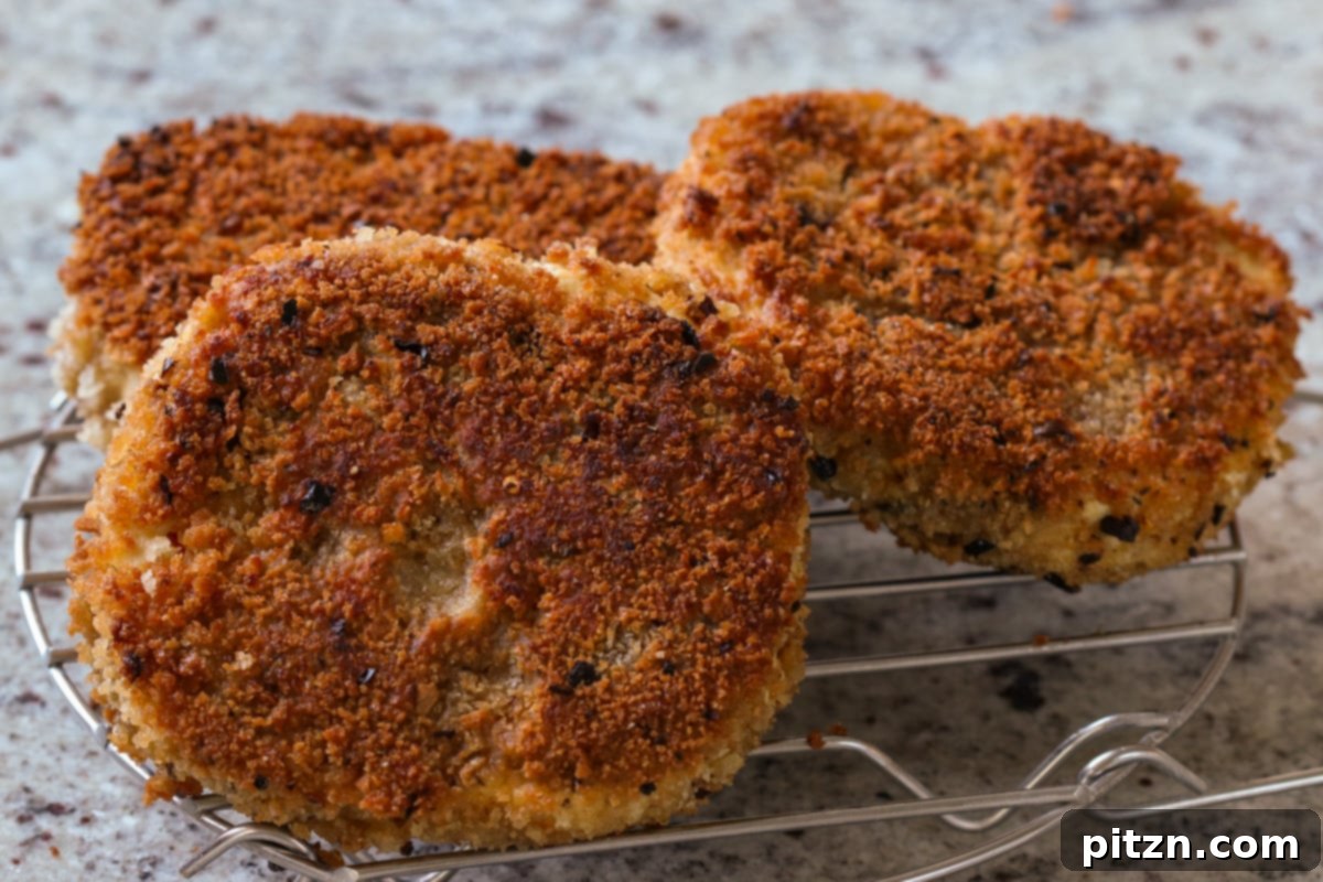 The Inclusive Crispy Vegan Chicken Sandwich 19 crispy vegan chicken cutlets on a wire rack