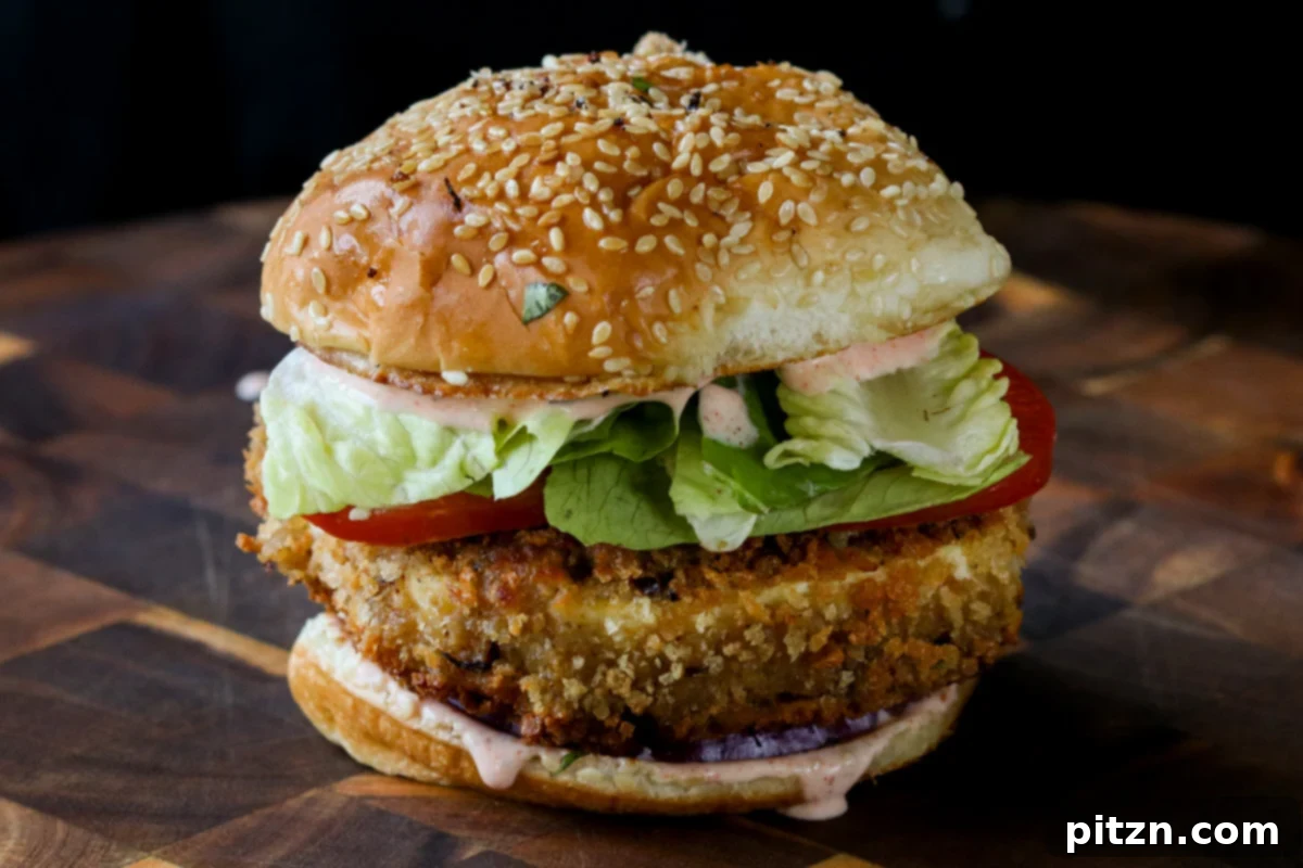 The Inclusive Crispy Vegan Chicken Sandwich 23 crispy vegan chicken sandwich on a wooden cutting board
