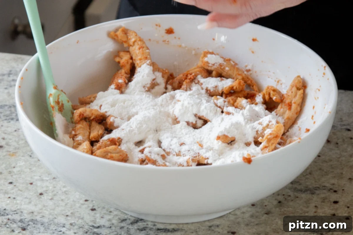 Zesty Indo Chinese Crispy Chicken and Soy Curls Nut Free Gluten Free Soy Free Adaptable 11 adding cornstarch, baking powder, and flour to the bowl of soy curls