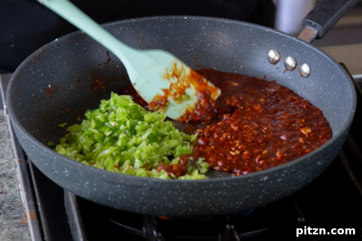 Zesty Indo Chinese Crispy Chicken and Soy Curls Nut Free Gluten Free Soy Free Adaptable 18 adding bell peppers to the sauce ingredients in the pan