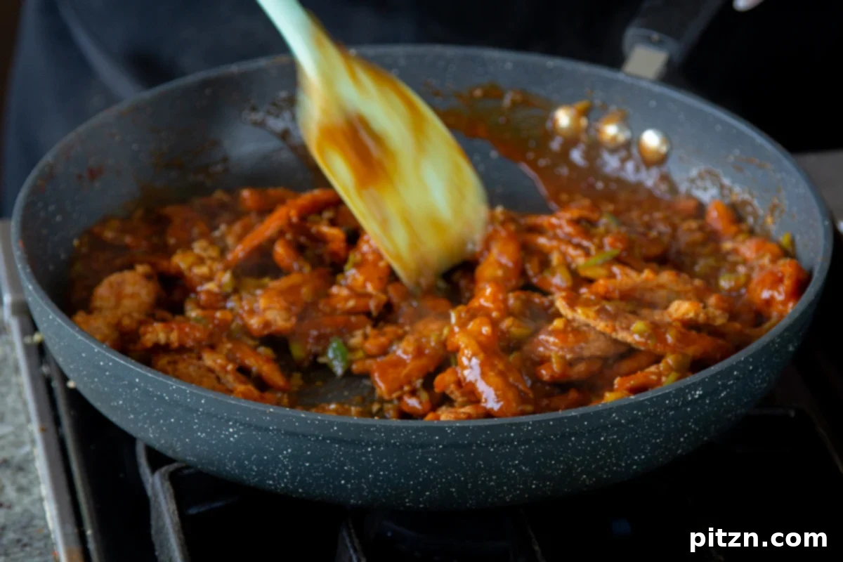 Zesty Indo Chinese Crispy Chicken and Soy Curls Nut Free Gluten Free Soy Free Adaptable 22 mixing soy curls into the sauce