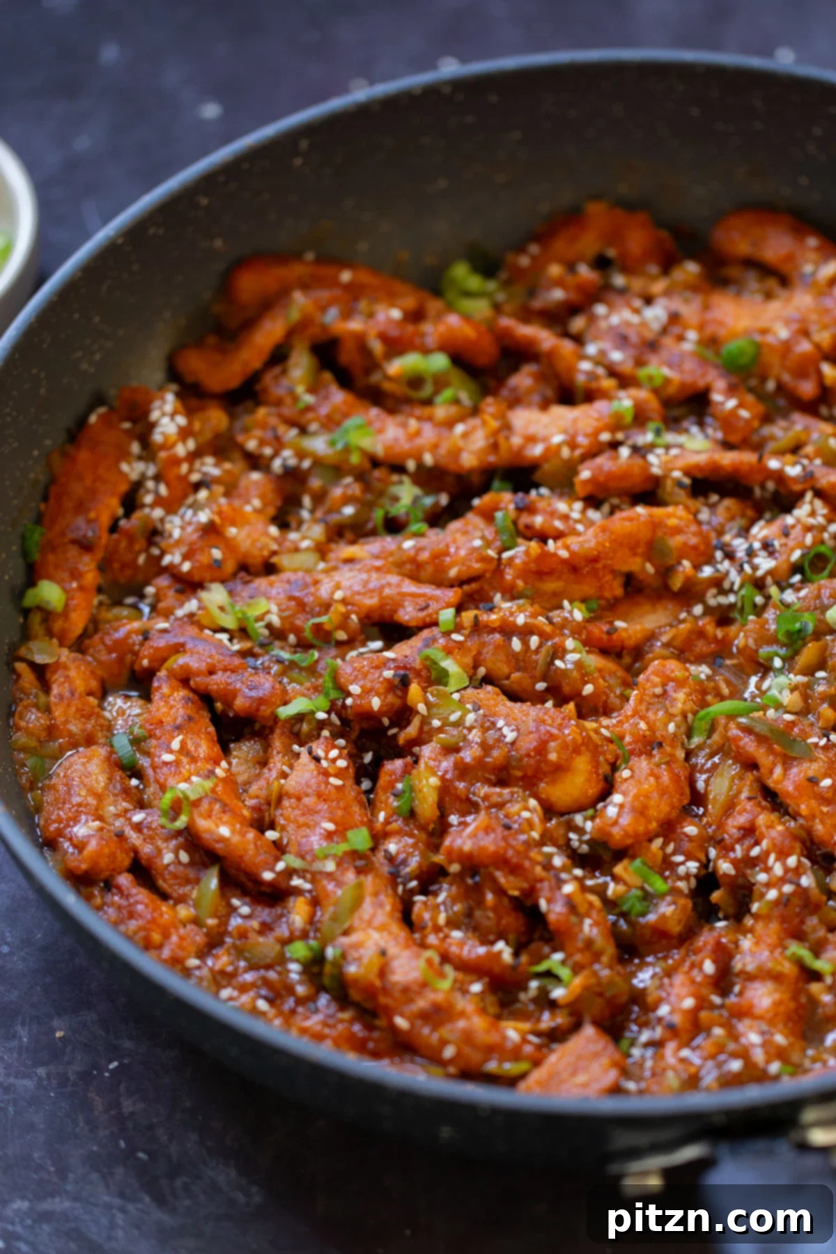 Zesty Indo Chinese Crispy Chicken and Soy Curls Nut Free Gluten Free Soy Free Adaptable 4 close-up of crispy Indo Chinese chicken in the pan with rice and green onions