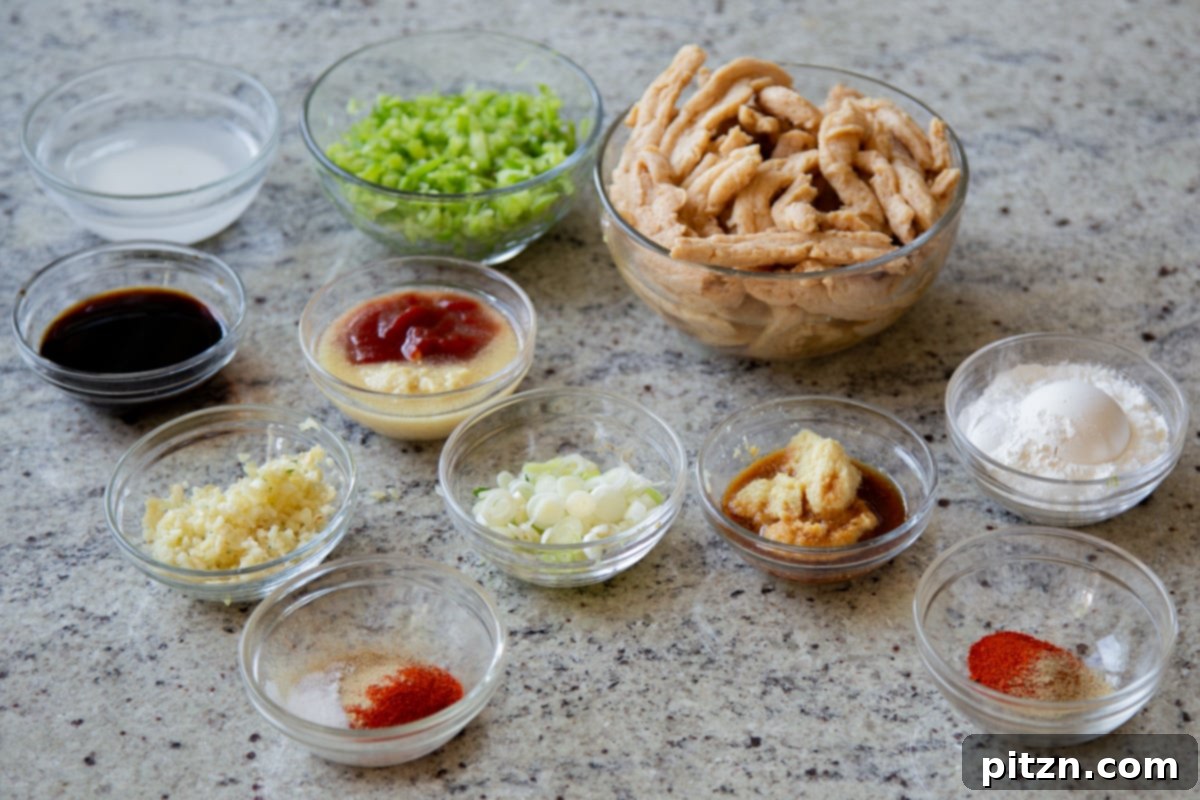 Zesty Indo Chinese Crispy Chicken and Soy Curls Nut Free Gluten Free Soy Free Adaptable 7 soy curls, bell pepper, and other Indo Chinese chicken ingredients in bowls on a kitchen counter