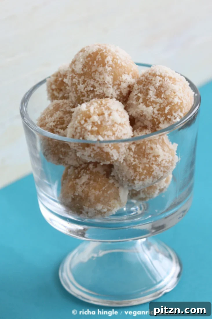 Fudgy Coconut Ladoo garnished with pistachios
