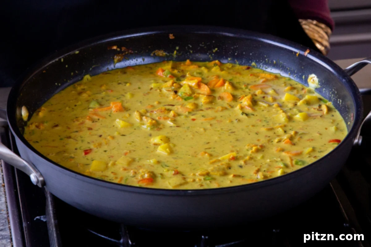 Simple One Pot Jamaican Curry Rice Gluten Free Nut Free 15 The rich, golden Jamaican curry sauce, vibrant and bubbling gently, ready for the addition of rice.