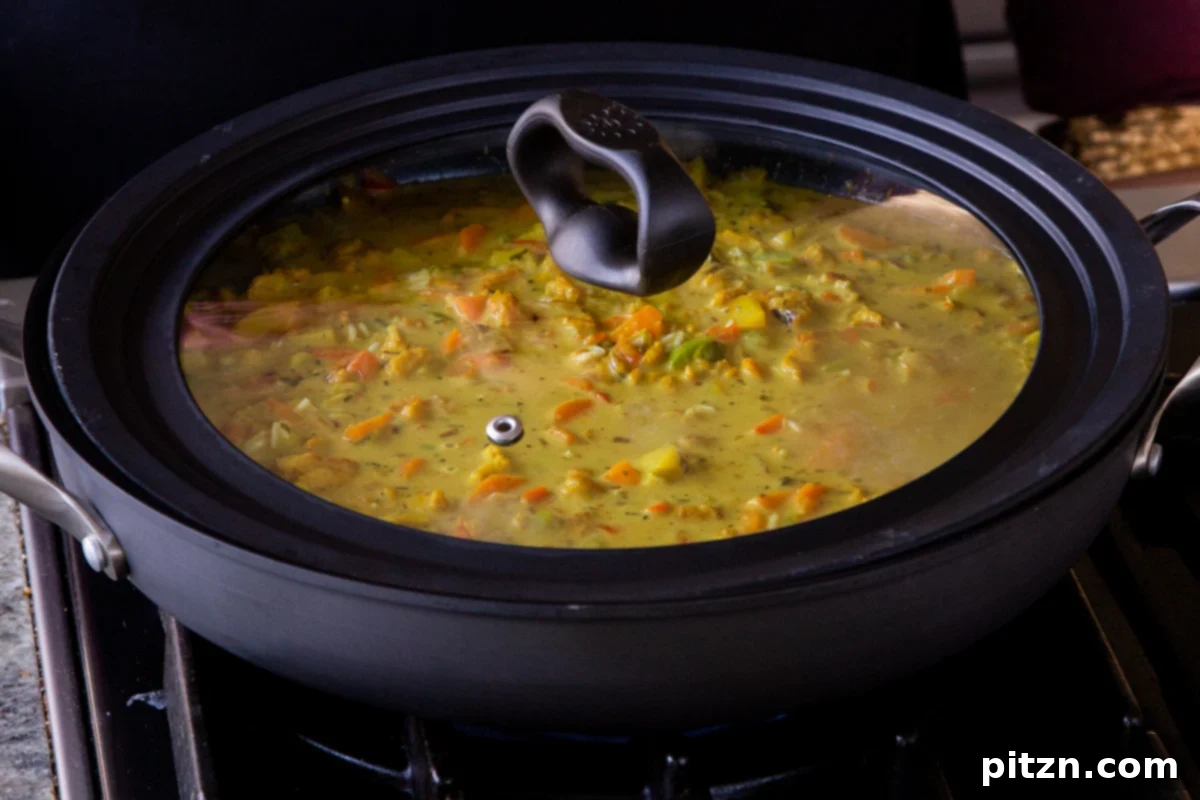 Simple One Pot Jamaican Curry Rice Gluten Free Nut Free 18 The pan of Jamaican curry rice with the lid securely on, ready to simmer on low heat until the rice is perfectly cooked.