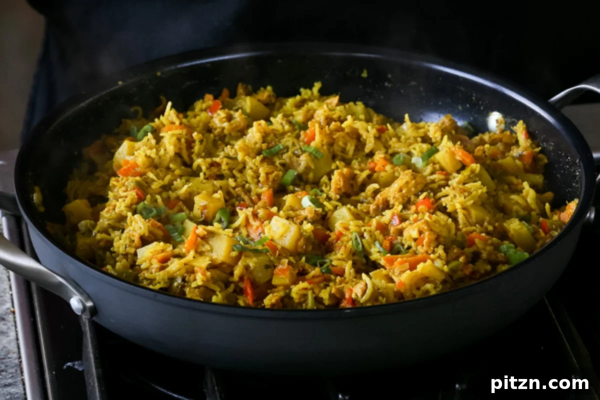 Simple One Pot Jamaican Curry Rice Gluten Free Nut Free 19 Beautifully fluffed Vegan Jamaican Curry Rice in the pan after cooking, ready for garnishing and serving.