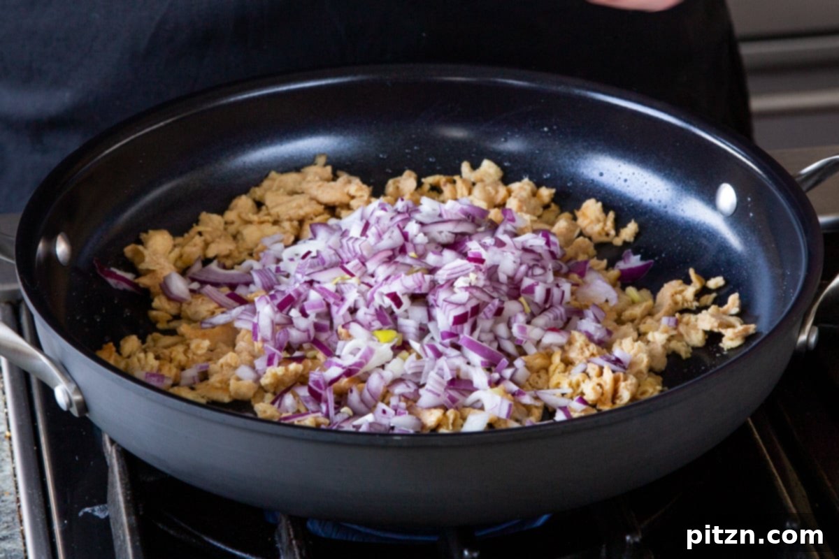 Simple One Pot Jamaican Curry Rice Gluten Free Nut Free 7 Sautéing soy curls and chopped onions with oil in a large skillet, browning the soy curls and making the onions translucent.