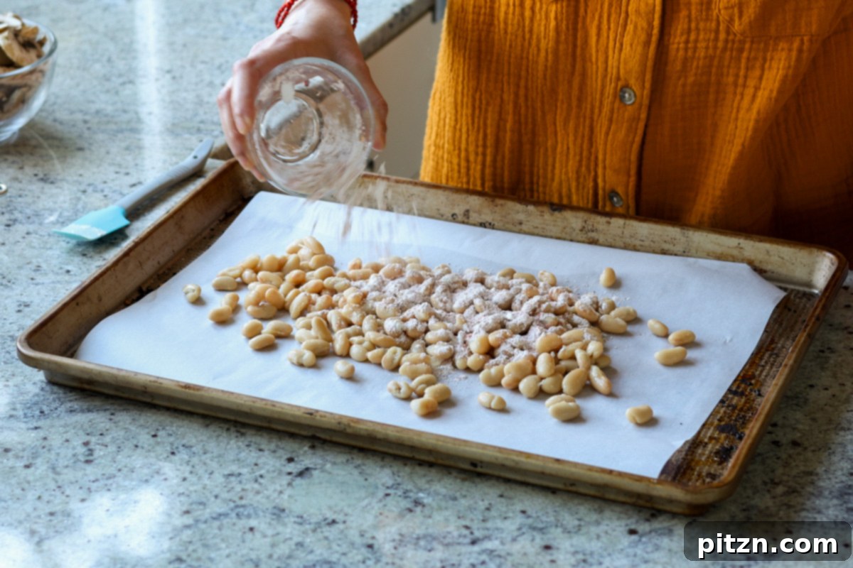 adding cornstarch and spices to the beans