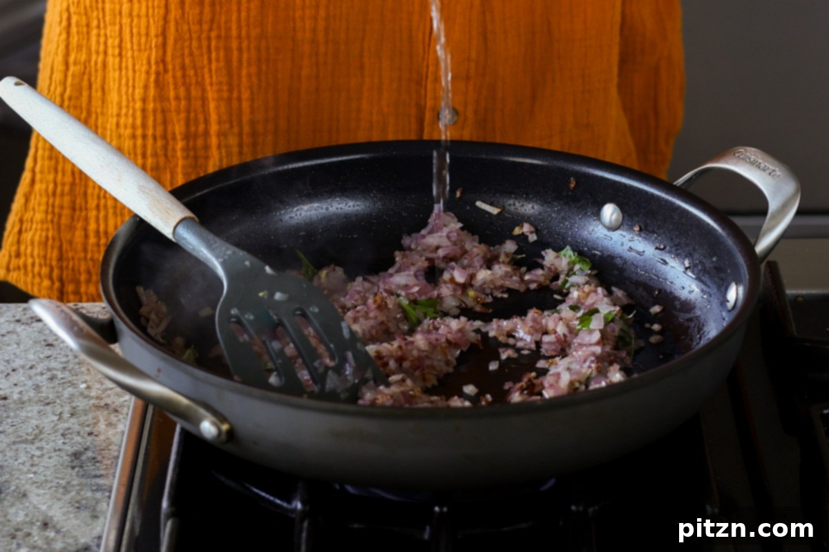 adding water to the pan