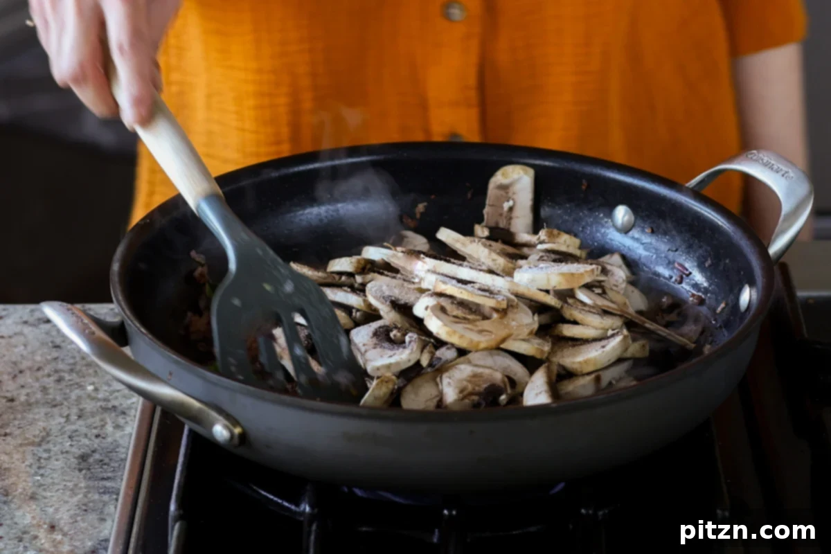 adding mushrooms to the pan