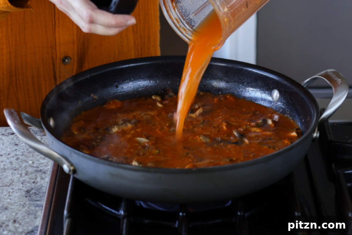 adding balchao paste to the pan