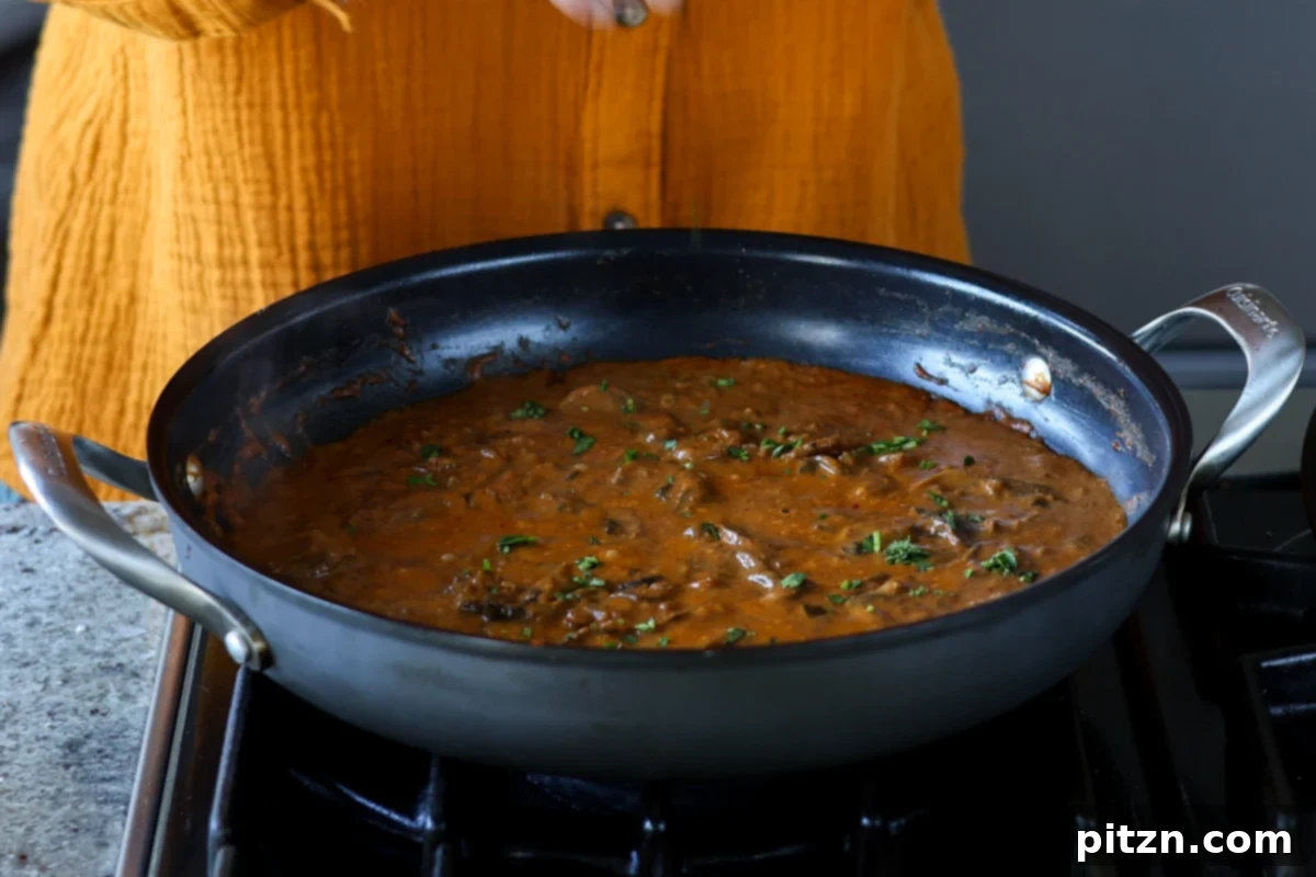 topping balchao mushrooms with cilantro