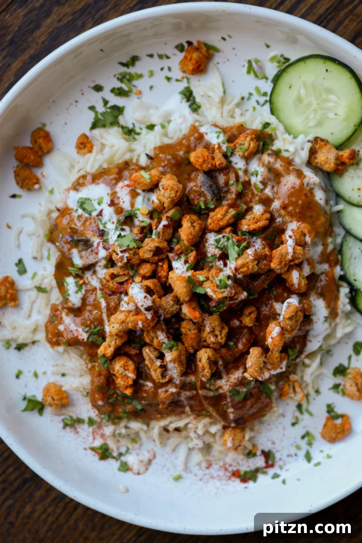 balchao mushrooms over rice topped with crispy beans