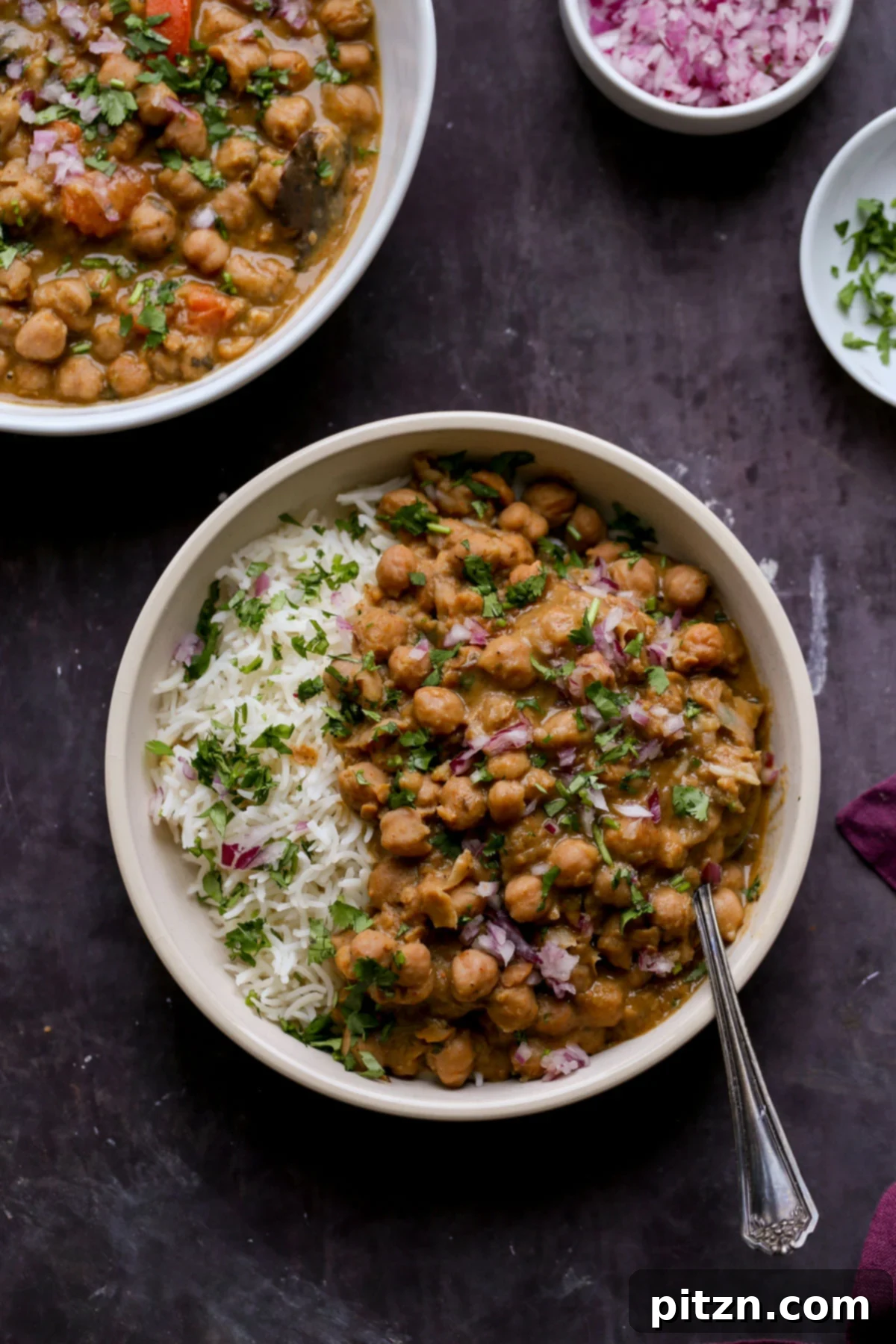 Instant Pot and Stovetop Punjabi Chole North Indian Chickpea Curry 2 bowls of Punjabi chole on a slate table