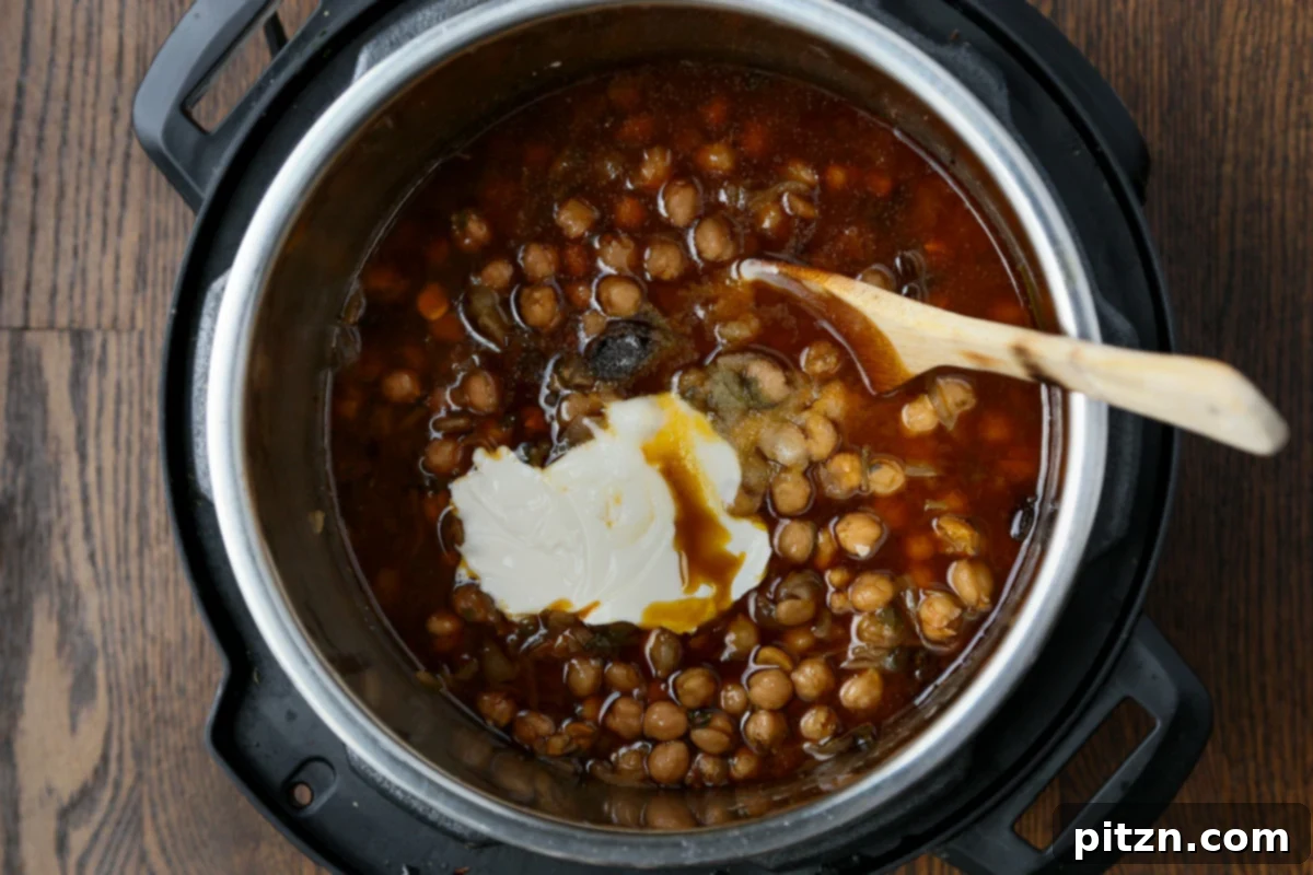 Instant Pot and Stovetop Punjabi Chole North Indian Chickpea Curry 16 adding nondairy yogurt to Punjabi chole in the Instant Pot