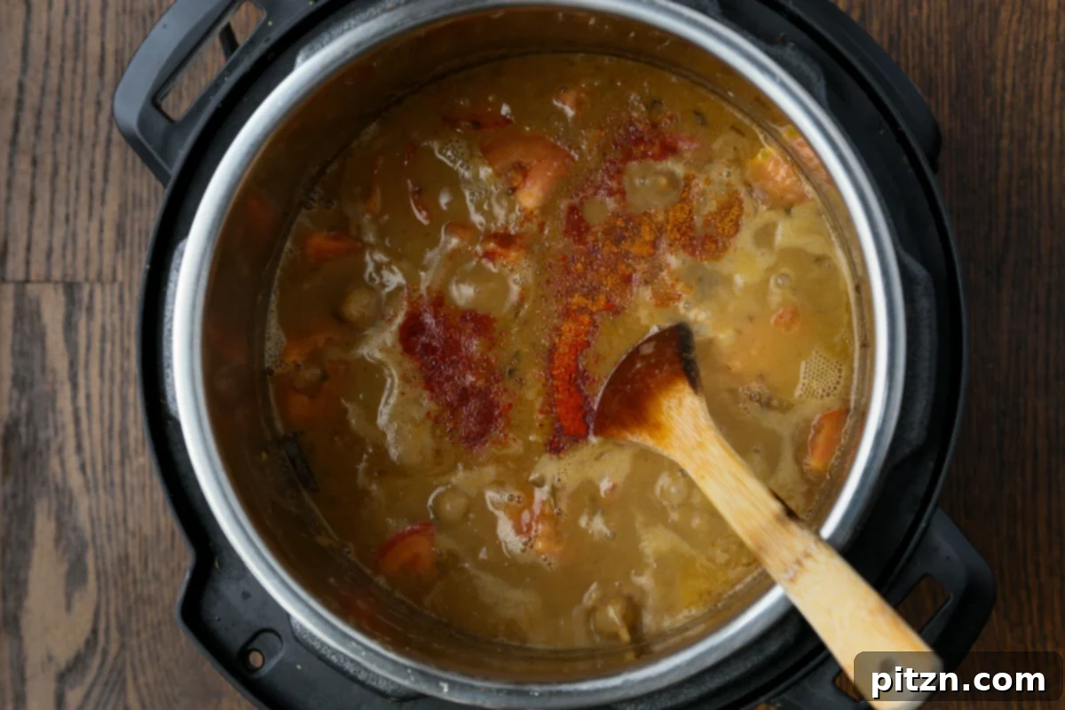 Instant Pot and Stovetop Punjabi Chole North Indian Chickpea Curry 19 adjusting flavors by adding more spices to the Instant Pot after cooking