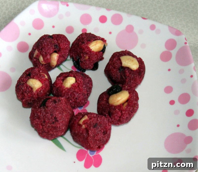 Strawberry Beet Oats Semolina Laddoo, colorful sweet balls made with fruit and grains.