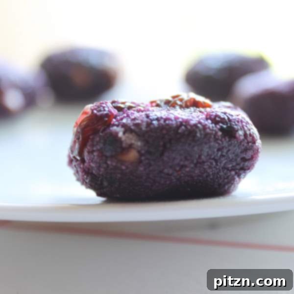 Blueberry Oats Semolina Laddoo, purple-hued sweet balls with fruit.