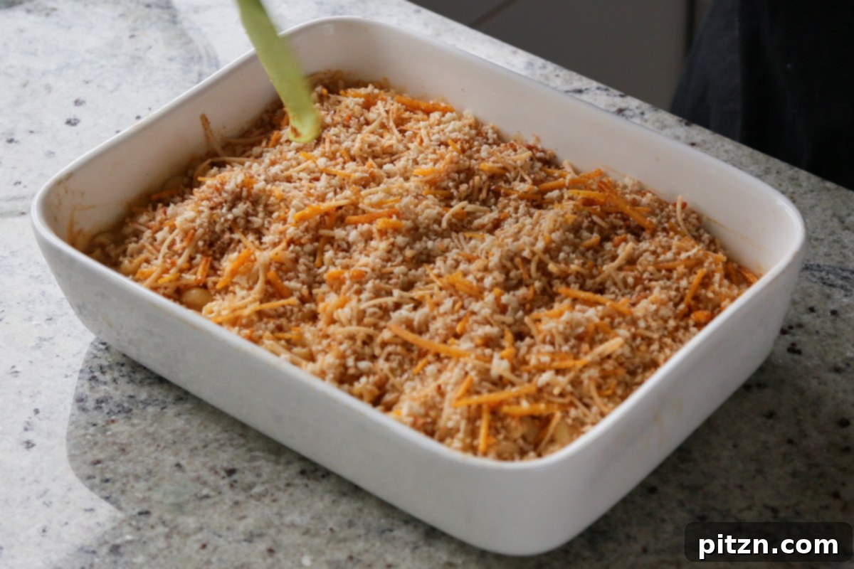 Creamy Smoky Vegan Mac and Cheese Bake 17 adding breadcrumb topping