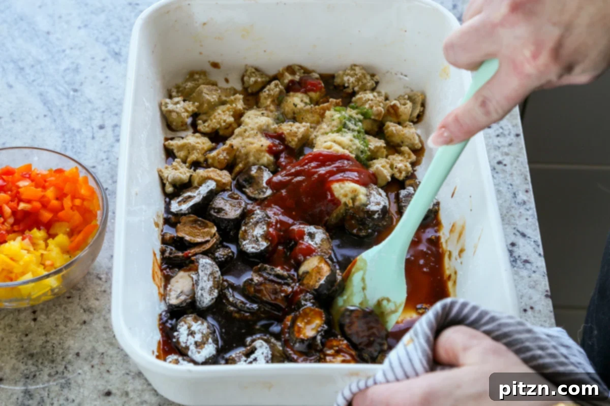 adding sauce ingredients to the pan of tofu and mushrooms