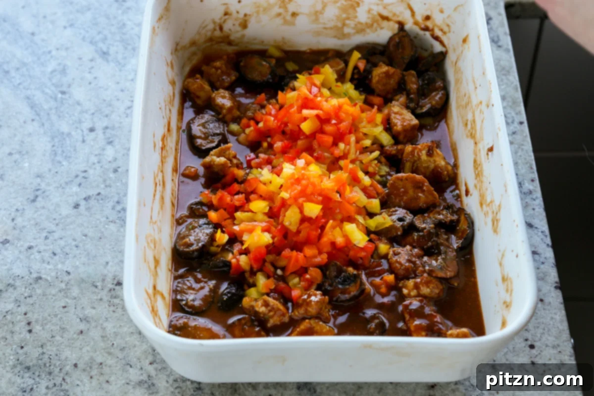 adding the bell pepper to the pan