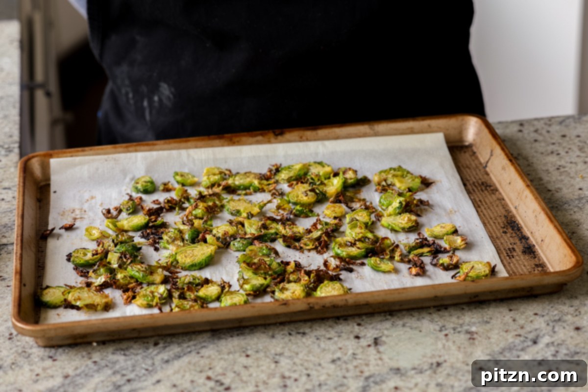 Roasted Shaved Brussels Salad with Walnut Crumble 11 roasted shaved Brussels sprouts on the baking sheet after baking
