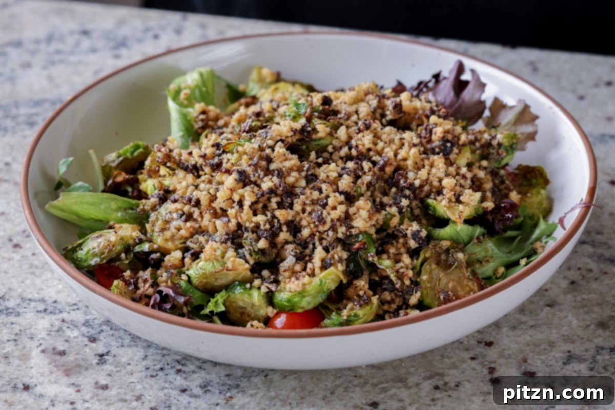 Roasted Shaved Brussels Salad with Walnut Crumble 16 walnut crumble on top of the salad before mixing in