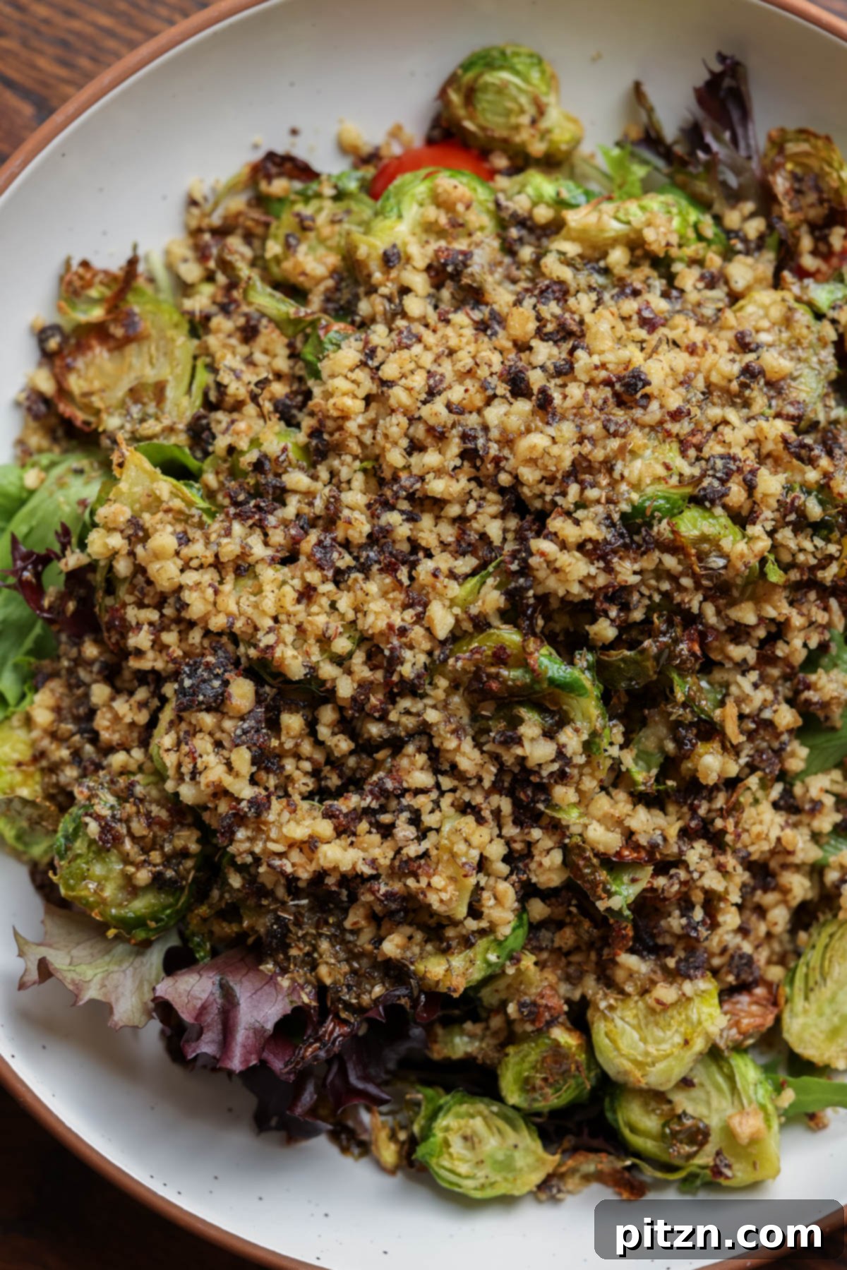 Roasted Shaved Brussels Salad with Walnut Crumble 4 walnut crumble on top of the salad before mixing in