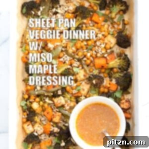 Sheet Pan Veggie Dinner with Broccoli, Sweet Potato, Tofu, Chickpeas, Sunflower seeds dressed with Miso Maple Dressing.