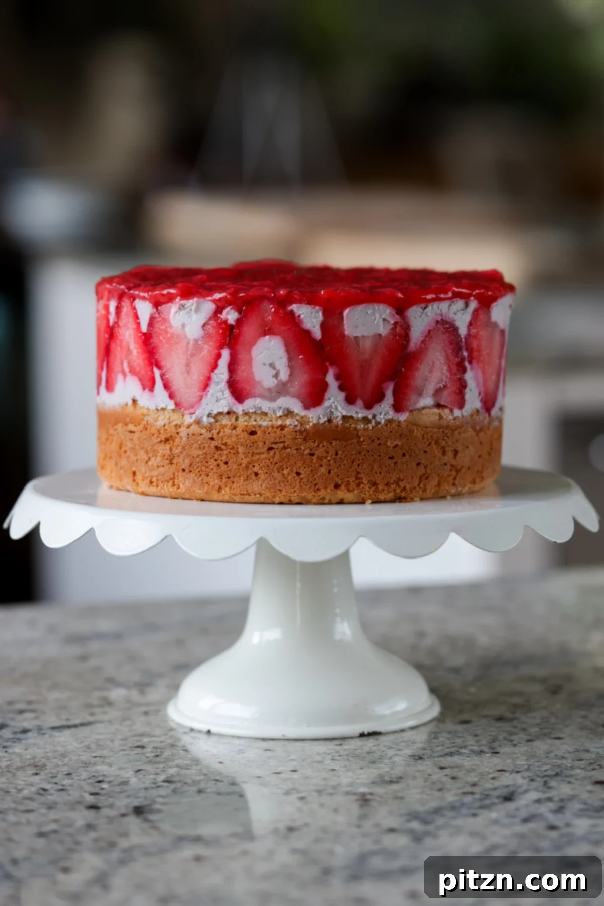 Vegan Strawberry Mousse Cake Gluten Free 2 Freshly sliced strawberry mousse cake on a wooden cutting board, showcasing its vibrant layers