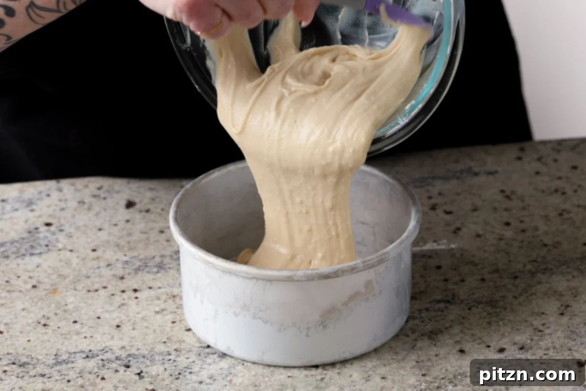 Vegan Strawberry Mousse Cake Gluten Free 13 Pouring the smooth cake batter into a parchment-lined cake pan