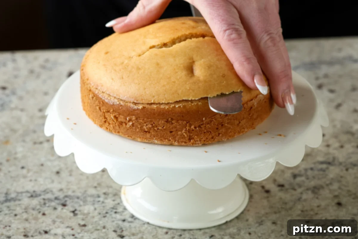 Vegan Strawberry Mousse Cake Gluten Free 20 Slicing the domed top off the baked cake to create a flat surface