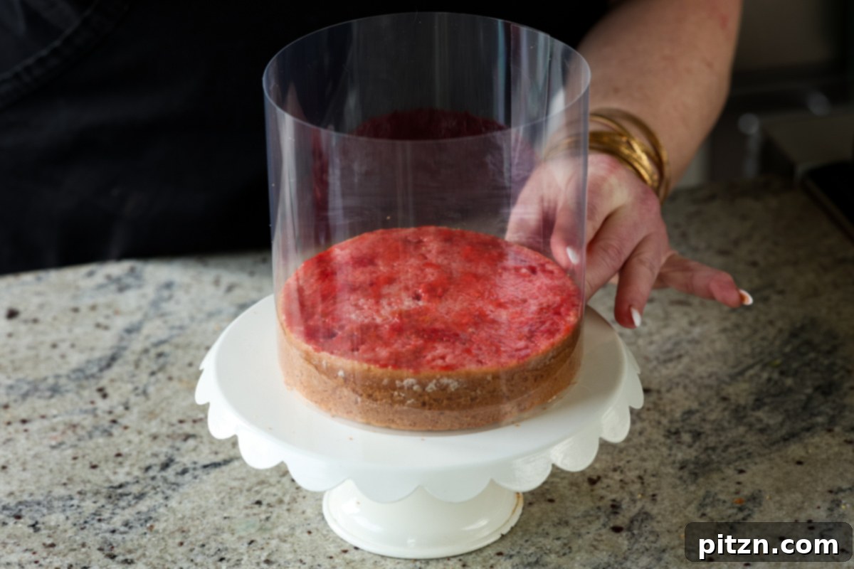 Vegan Strawberry Mousse Cake Gluten Free 23 Securing a cake collar around the cake base on a cake stand