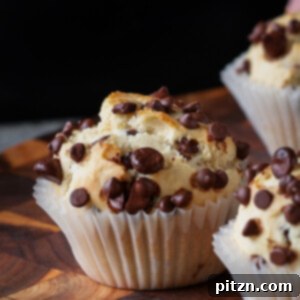 Vegan chocolate chip muffin on a wooden cutting board