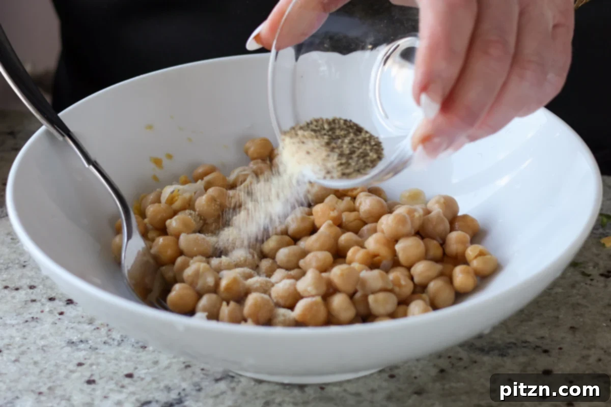 Gochujang Chickpea Sandwich with Sweet and Spicy Caramelized Onions 12 adding salty and spices to the chickpeas