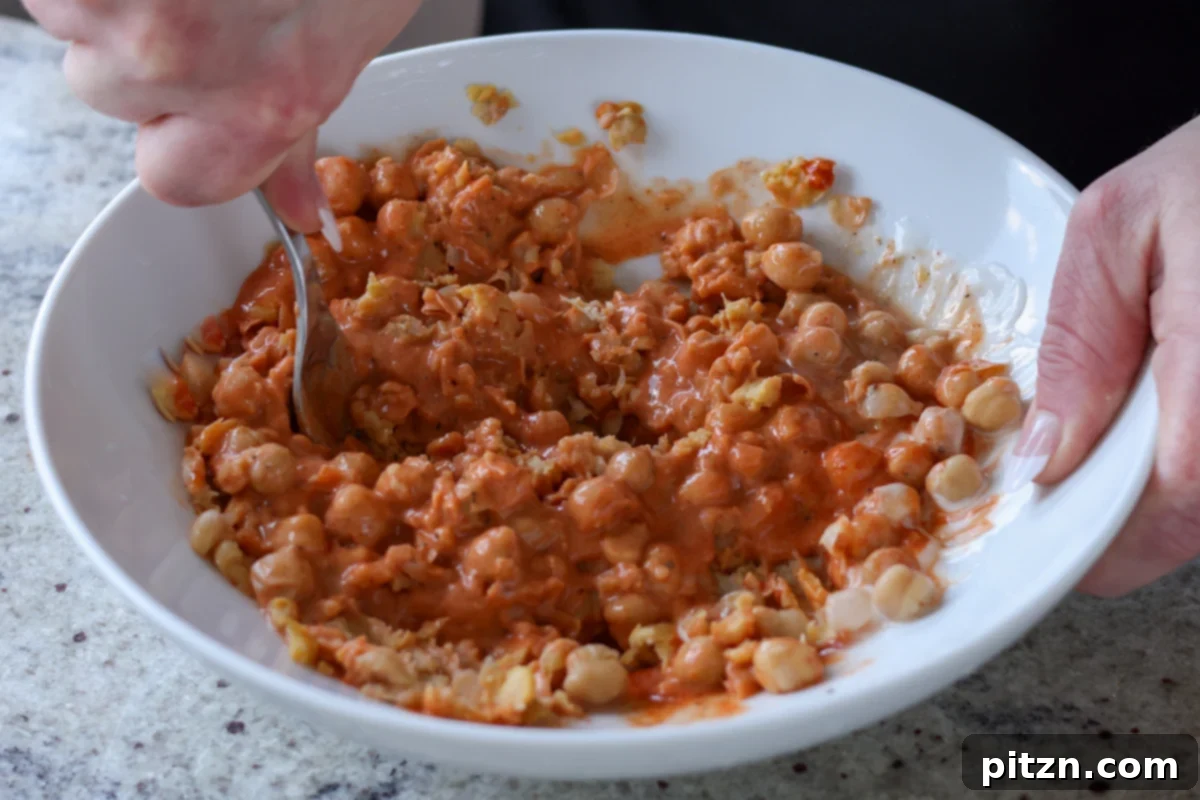 Gochujang Chickpea Sandwich with Sweet and Spicy Caramelized Onions 15 mashing the chickpeas with the seasonings