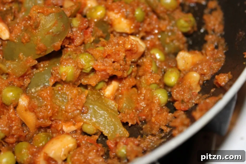 Fresh cilantro and ripe red tomatoes ready to be transformed into a rich, aromatic curry paste.