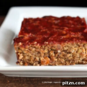 Plant Powered Lentil Quinoa Loaf 3 A slice of the perfectly baked vegan lentil quinoa loaf, showcasing its rich texture and savory appeal.