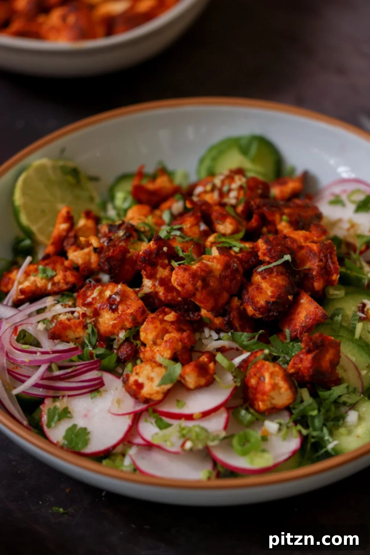 30-Minute Harissa Tofu Bowls for All Diets 2 harissa tofu bowl with fresh veggies and herbed rice