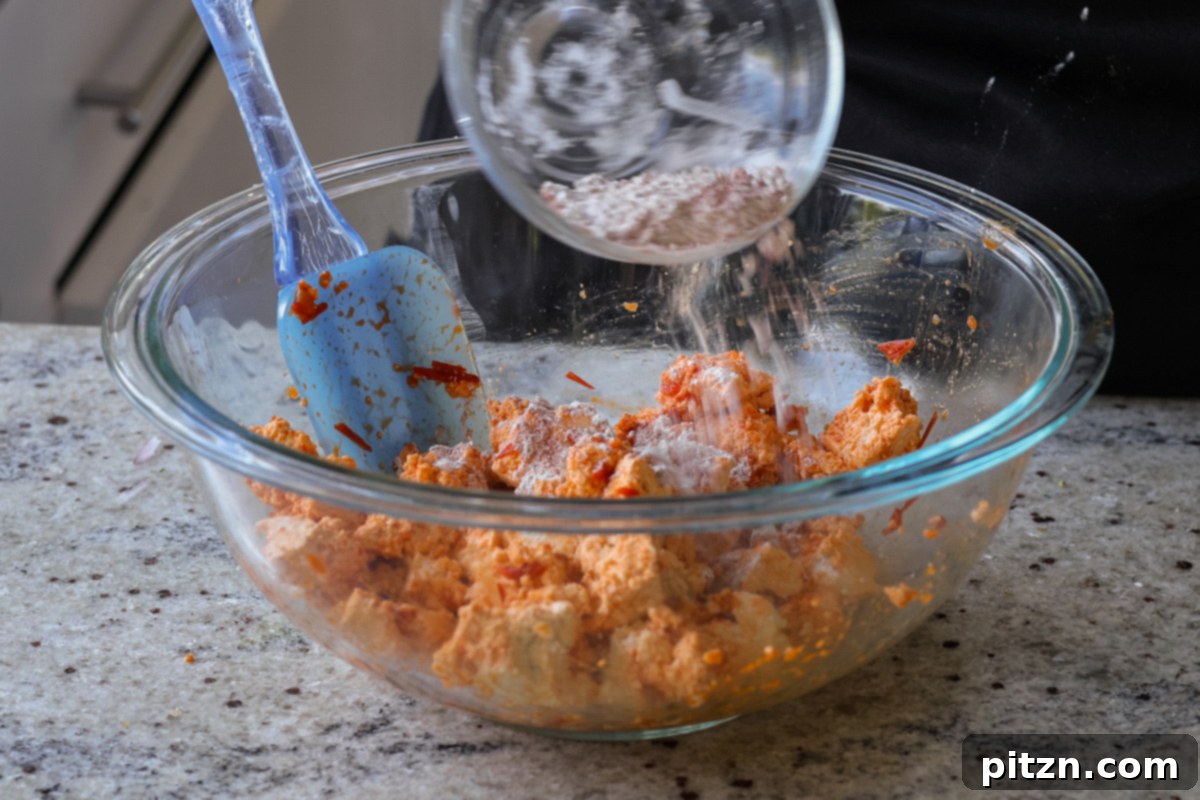 30-Minute Harissa Tofu Bowls for All Diets 10 sprinkling cornstarch mixture over the tofu