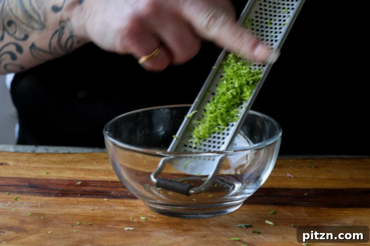 30-Minute Harissa Tofu Bowls for All Diets 14 zesting the lime