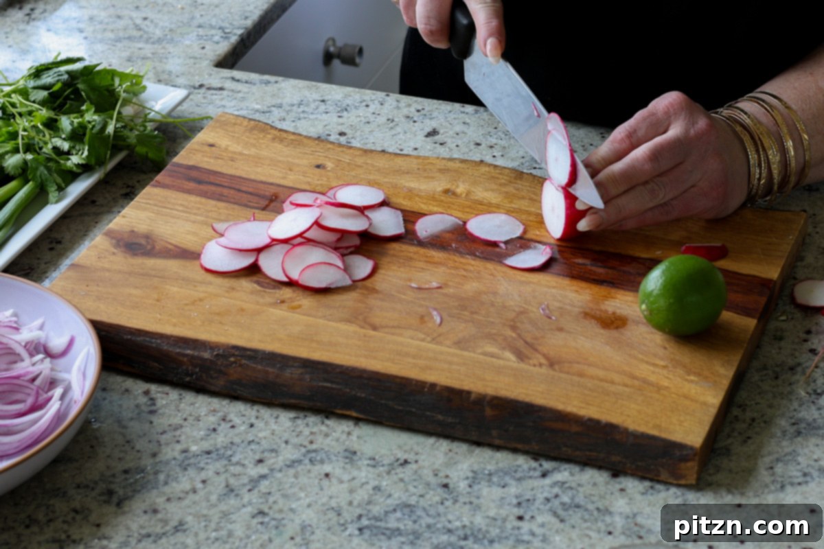 30-Minute Harissa Tofu Bowls for All Diets 18 slicing the radish